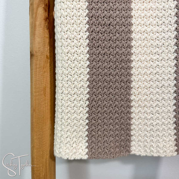 close up of the texture of a suzette stitch baby blanket