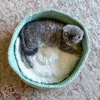 kitten inside a crochet pet bed