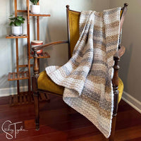 crochet blanket draped on a chair