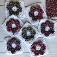 white solid crochet squares with flowers