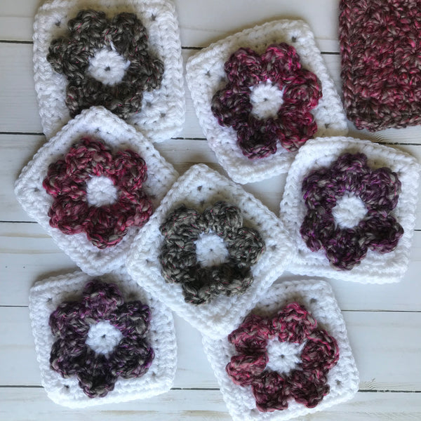 white solid crochet squares with flowers