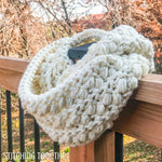 chunky crochet infinity scarf on deck railing
