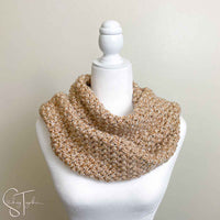 bean stitch crochet scarf wrapped around the neck of a mannequin 