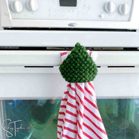 tree kitchen towel and topper hanging on an oven