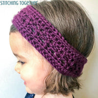toddler wearing a purple crochet headband