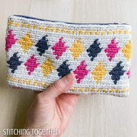 crochet pouch with colorful diamonds on it