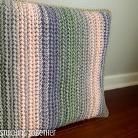 crochet cushion with stripes