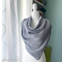 gray crochet triangle shawl on mannequin 