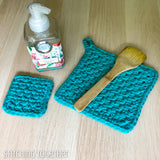 potholders crochet, soap and a wooden spoon
