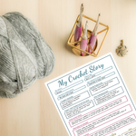 my crochet story printable next to yarn and hooks
