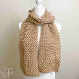 crochet scarf with zigzag puff stitches draped on a mannequin