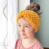 girl wearing crochet ear warmer
