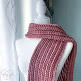 chunky yarn crochet scarf draped on a mannequin