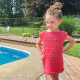girl wearing a crochet dress while standing by a pool