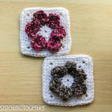 two crochet flower squares one with pink petals on white and one with gray petals on white