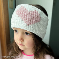 girl wearing crochet headband with heart