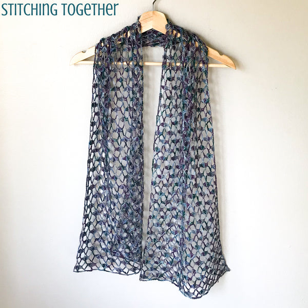 crochet lacy scarf on hanger