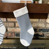 gray and white crochet Christmas stocking