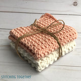 2 crochet washcloths tied with twine