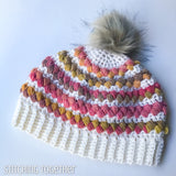 crochet women's hat with pom and colorful puff stitches