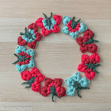 a circle of colorful butterflies crocheted