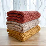 stack of folded crochet dish towels