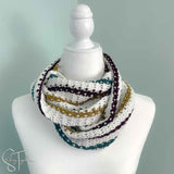 striped crochet infinity scarf wrapped on the neck of a mannequin