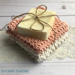 2 crochet washcloths and a bar of soap tied with twine