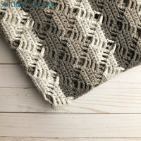 close up of diamond lace crochet baby blanket