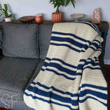 striped crochet throw draped on a couch