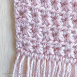 close up of fringe and crochet scarf stitches