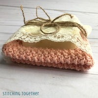 crochet washcloth and a bar of soap tied with twine