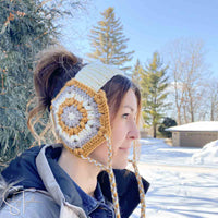 woman wearing granny hexagon head warmer