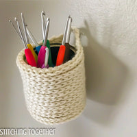 hanging crochet basket holding crochet hooks