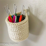 hanging crochet basket holding crochet hooks
