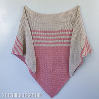 pink and tan striped triangle shawl hanging