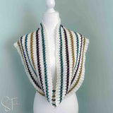 striped crochet infinity scarf spread out and draped around the neck of a mannequin