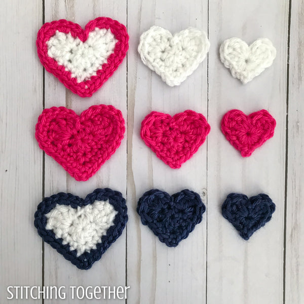 crochet hearts of different colors and sizes