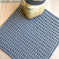 gray crochet washcloth pictured with body wash