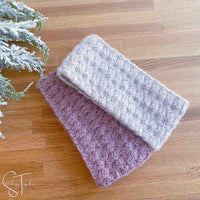 2 crochet ear warmers laying flat