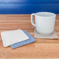 basic square crochet coasters with a coffee mug