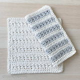 textured crochet dishcloths one folded on top of the other