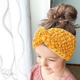 girl wearing cute twisted headband crochet